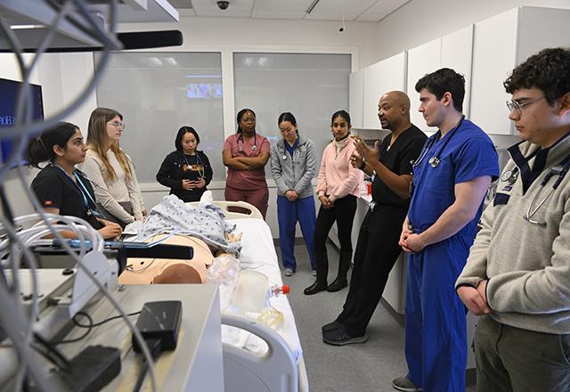 Students learning in the SIM lab